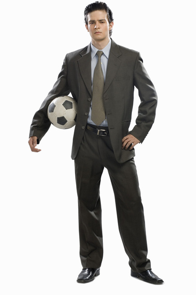 Businessman holding a soccer ball - Foto, Imagen