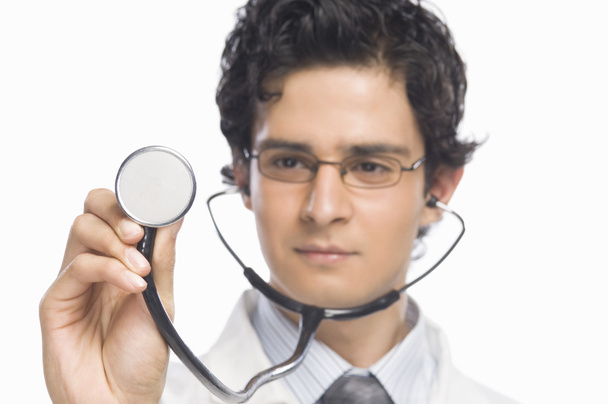 Doctor holding a stethoscope - Foto, Imagen