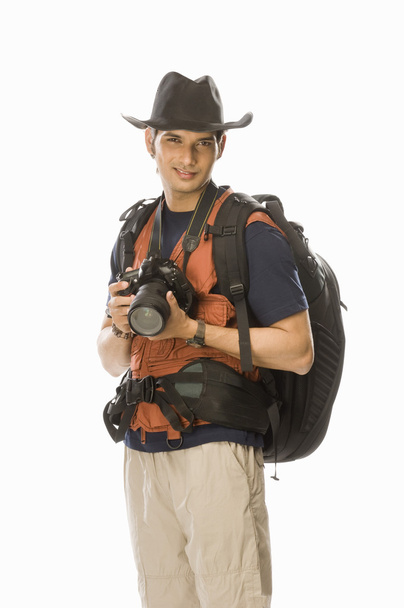 Photographer holding a digital camera - Photo, image