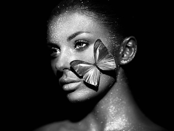 Fashion model woman with blue butterfly - Fotó, kép