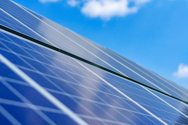 Solar panels on blue sky background - Фото, изображение
