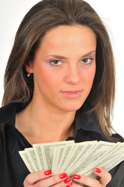 Woman holds dollar bills in her hands - Φωτογραφία, εικόνα