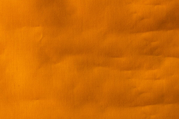 Real orange canvas with wrinkles as a background. - Fotó, kép
