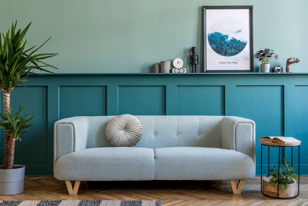 Modern green colored design of interior with comfortable stylish sofa - Foto, Imagem