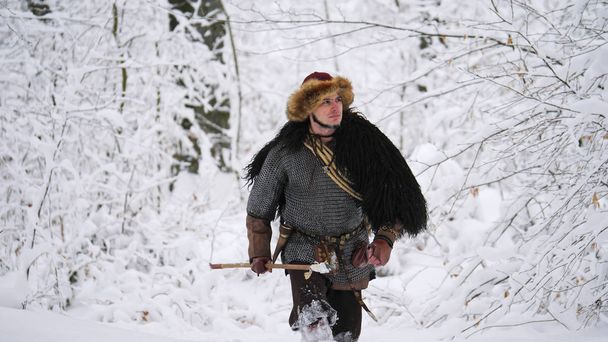 Man viking going in the winter forest. - Photo, Image