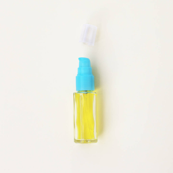 Natural essential cosmetic body serum on a yellow background. - Photo, Image