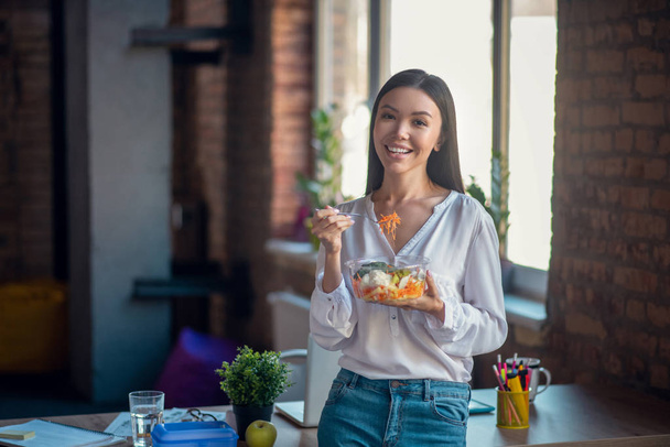 Nice good looking woman standing with her salad - Photo, Image
