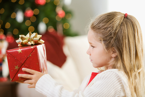 Christmas: Girl Thinking About Christmas Gift - Valokuva, kuva