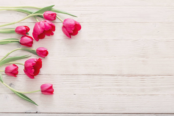 pink tulips on white wooden background - Φωτογραφία, εικόνα