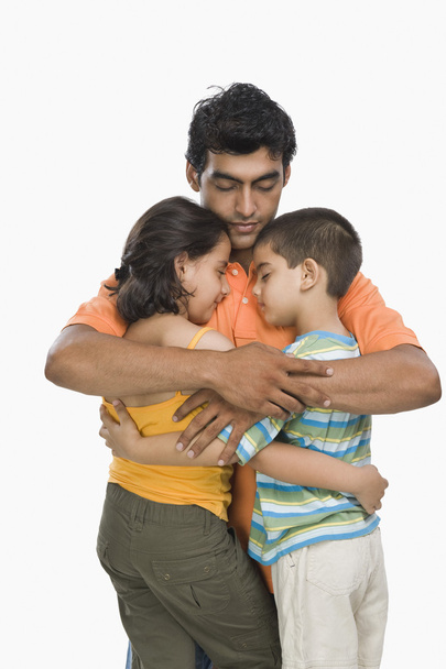 Man hugging his children - Fotó, kép