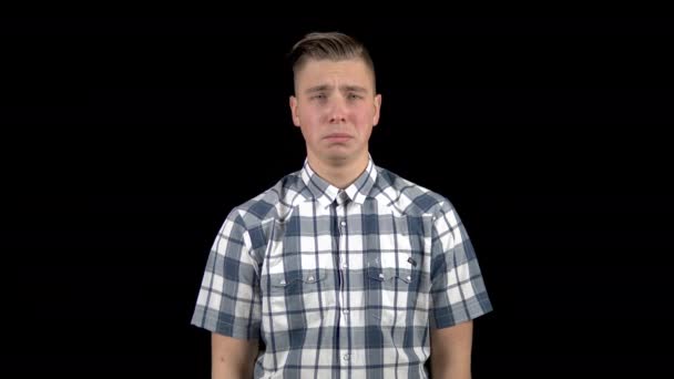 The young man is crying. Emotional man crying on a black background. - Footage, Video