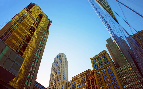 Modern glass skyscrapers under the clear blue sky reflex - Foto, Bild