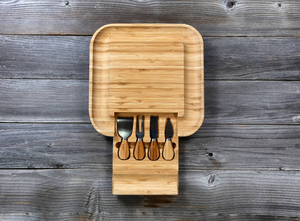 Overhead view of bamboo food server with various utensils - Photo, Image