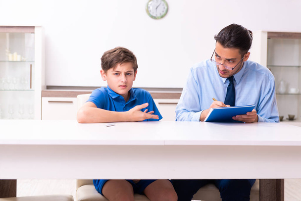 Busy father helping his son to prepare for exam - Photo, Image