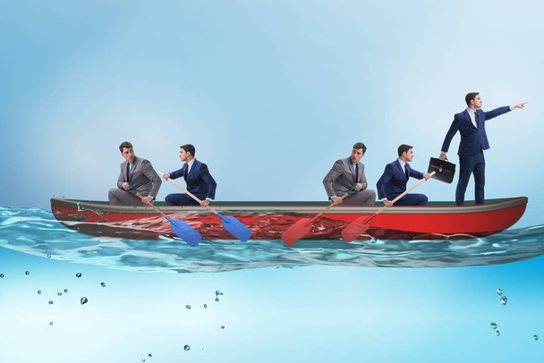 Disagreement concept with businessmen rowing in different direct - Photo, Image