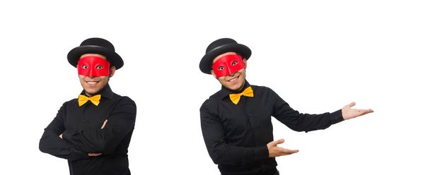 Mladý muž v černém kostýmu a červené masce izolované na bílém - Fotografie, Obrázek