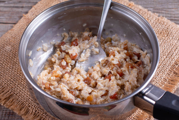 Oatmeal porridge in a saucepan - Photo, Image