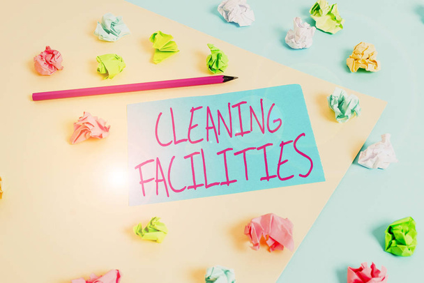 Writing note showing Cleaning Facilities. Business concept for Place or equipment provided for a cleaning purposes Colored crumpled papers empty reminder blue yellow clothespin - Photo, Image