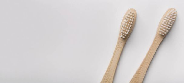 Two eco natural bamboo toothbrushes on white background - Foto, Bild