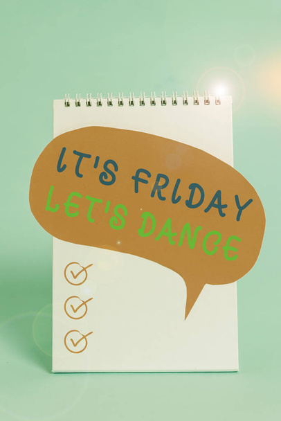 Word writing text It s is Friday Let s is Dance. Business photo showcasing Celebrate starting the weekend Go party Disco Music Standing blank spiral notepad speech bubble lying cool pastel background - Fotoğraf, Görsel