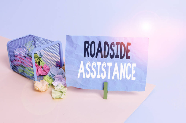 Conceptual hand writing showing Roadside Assistance. Concept meaning helps drivers when their vehicle breaks down on the road Trash bin crumpled paper clothespin reminder office supplies - Photo, image