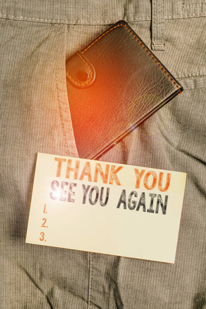 Writing note showing Thank You See You Again. Business concept for Appreciation Gratitude Thanks I will be back soon Small wallet inside trouser front pocket near notation paper - 写真・画像