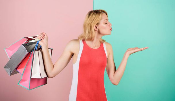 Purchase concept. special offer on black friday. shop closeout. happy woman shopper. big sale. female shopaholic hold shopping bags. present packages for holiday preparation. summer discount - Valokuva, kuva