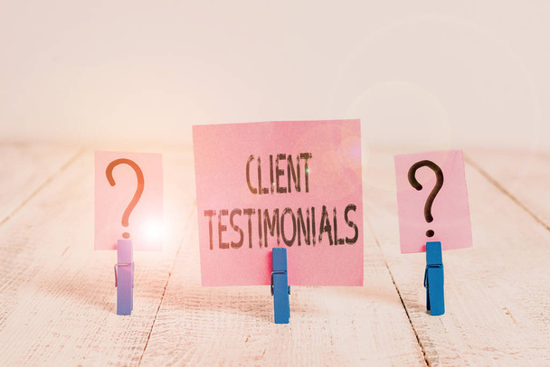 Text sign showing Client Testimonials. Business photo showcasing Written recommendation from a satisfied customer Scribbled and crumbling sheet with paper clips placed on the wooden table - Photo, Image