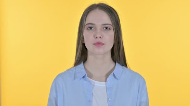 Portrait of Angry Young Woman Arguing, Yellow Background - Záběry, video