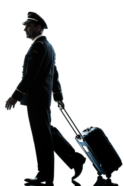 man in airline pilot uniform silhouette - Valokuva, kuva