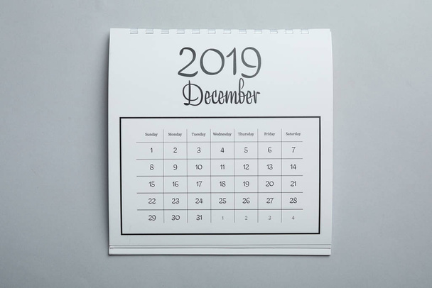 December 2019 calendar on light grey background, top view - Foto, imagen