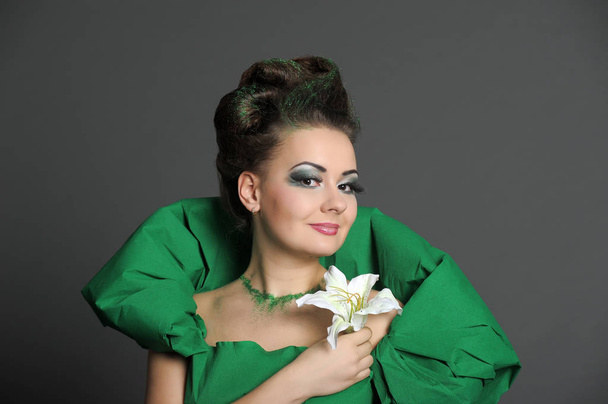 portrait of a girl in green with stylish hair styling and creati - Фото, зображення