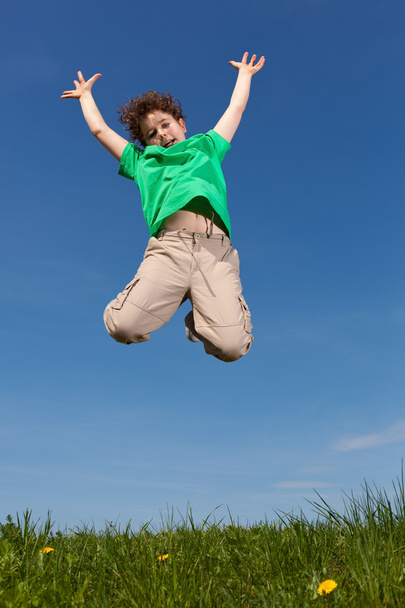 Boy jumping outdoor - Photo, image