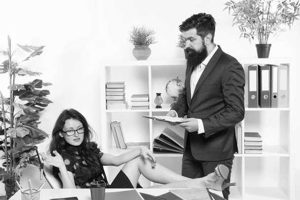 Married to their work. Sexy woman and bearded man run business together. Couple of business partners. Business professionals at work. Formal business meeting in office - Foto, afbeelding