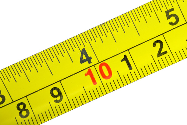 Крупним планом знімок жовтого металу вимірювальної стрічки
 - Фото, зображення