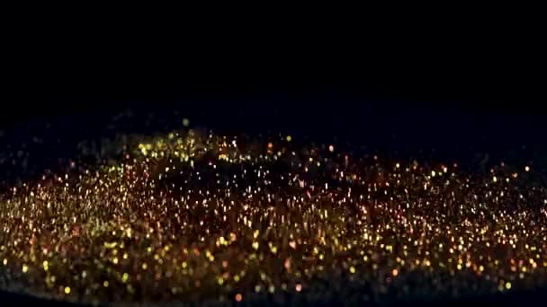 Prellen von Goldpartikeln auf schwarzem Hintergrund, das Konzept von Rhythmus oder Musik - Filmmaterial, Video