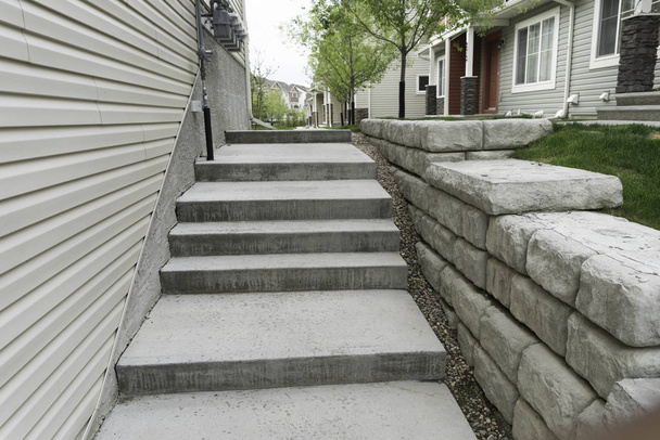 Walway in Apartment block with small retaining wall - Photo, Image