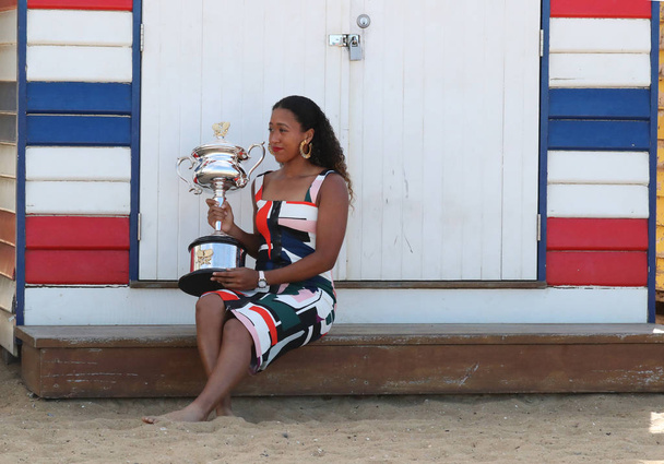 MELBOURNE, AUSTRALIA - JANUARY 27, 2019: 2 times Grand Slam Champion Naomi Osaka of Japan posing with Australian Open trophy at Brighton Beach in Melbourne after her victory at 2019 Australian Open - Fotó, kép