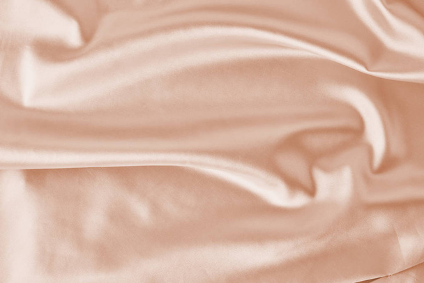 Fundo de seda rosa claro com dobras. Textura abstrata da superfície ondulada de cetim
 - Foto, Imagem