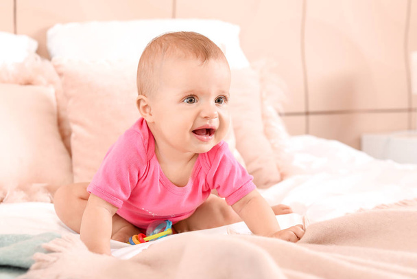 Portrait of cute little baby on bed at home - Fotoğraf, Görsel