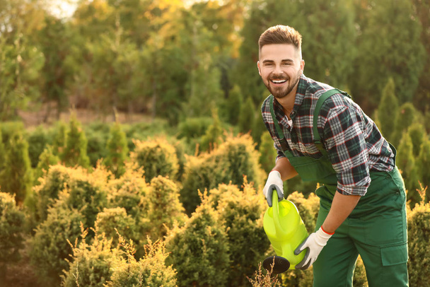 Handsome male gardener working outdoors - Photo, Image