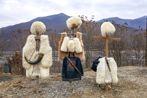 National clothes of Georgian shepherds burka and papakha against mountains - Photo, Image