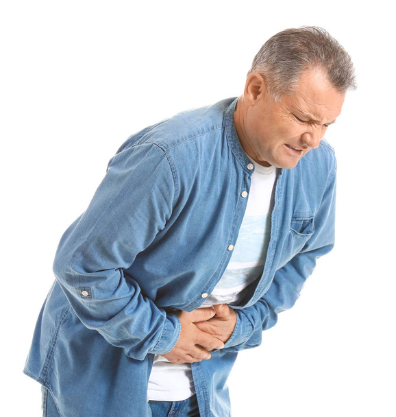 Mature man suffering from abdominal pain on white background - Photo, Image