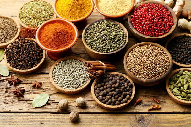 spices assortment on rustic table background - 写真・画像