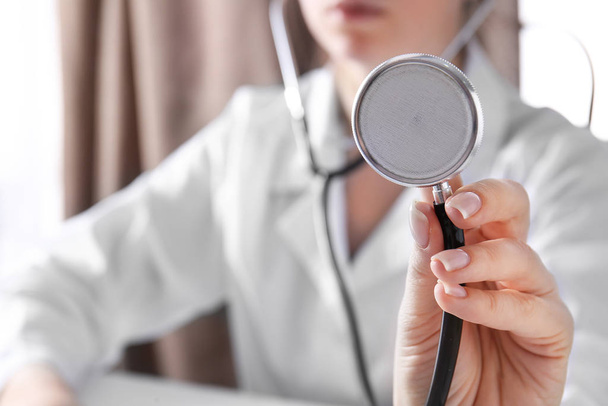 Doctor with stethoscope in clinic, closeup - Photo, Image