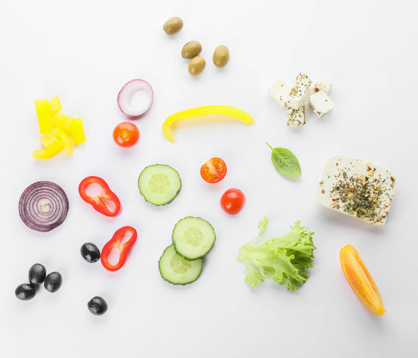 Ingredients for tasty Greek salad on white background - Фото, изображение