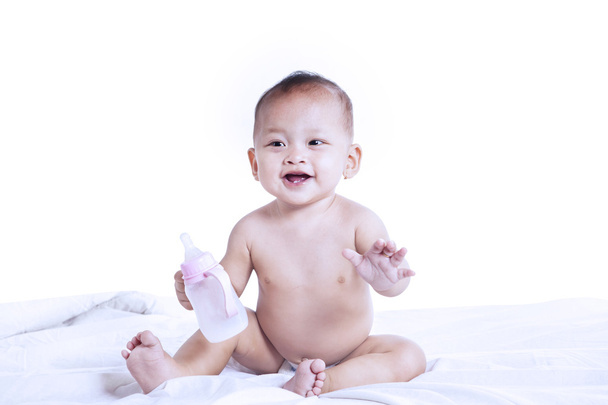 Cute baby with milk bottle - Zdjęcie, obraz
