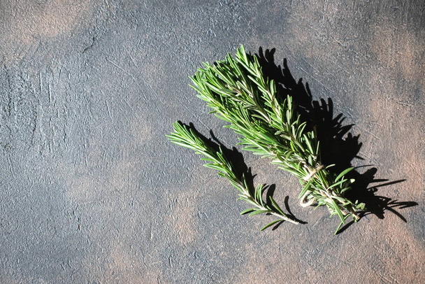 Bunch of fresh rosemary on a black background.Top view with copy space. - Foto, immagini