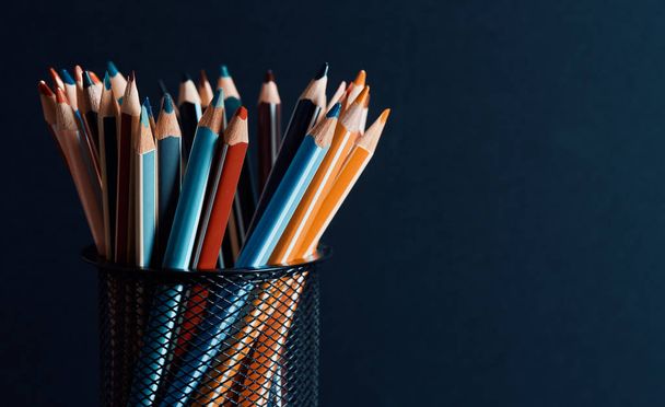 color pencils over black background with copy space - Foto, imagen