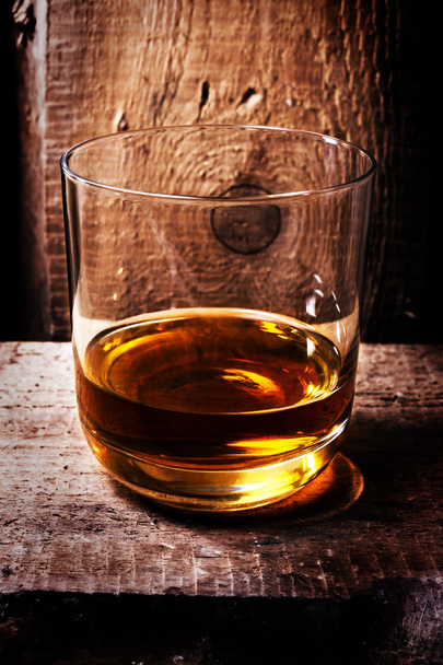 Whiskey Scotch in a glass and a bottle - Фото, изображение